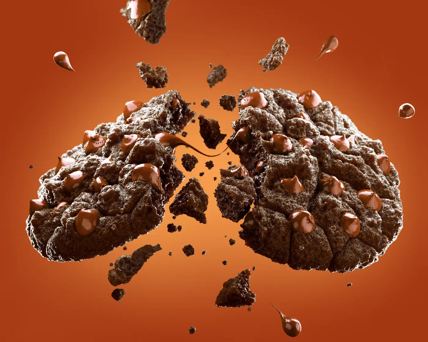 Exploding chocolate chip cookie rendered in CGI
